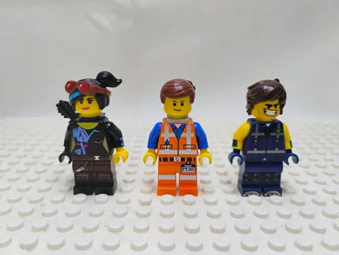 Three (3) Lego Minifigures Wildstyle, Rex, And Emmet