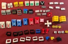 Lego lot of 60+ assorted pieces: instrument panels, cabinet pulls, numbers, etc.