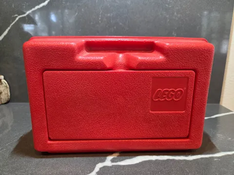 vintage 1980s red plastic Lego carrying and storage case by Interlego.