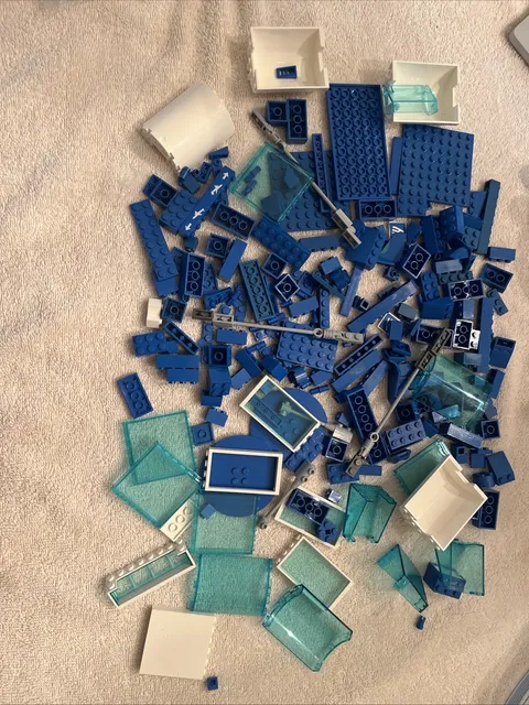 Lot of assorted  Blue/White 'Airport'  Lego pieces.   15.1  Ounces.