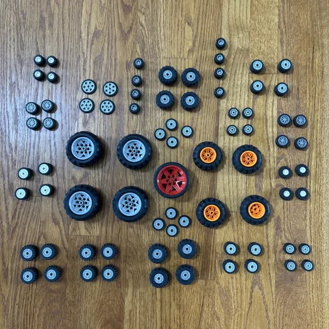 Huge Lot Of LEGO Black Tires & Wheels w Rims & Axles in White Gray Red Orange