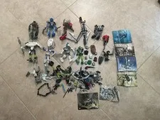 Lego Lot 2lbs 4oz of BIONICLE Masks Weapons, Parts. 8570,8571, 8618,8746,8566