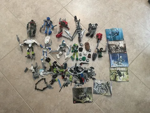 Lego Lot 2lbs 4oz of BIONICLE Masks Weapons, Parts. 8570,8571, 8618,8746,8566