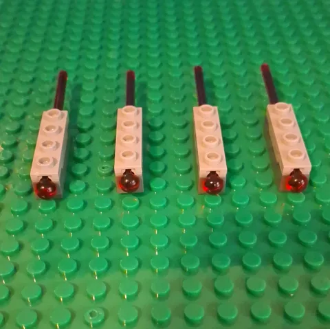 LEGO Light Bluish Gray 1x4 spring Launcher With Red Missile. 4 Total