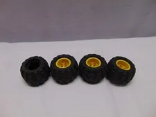 (4) Lego rubber tires with yellow rims 43.2 x 28 S 1 1/2" x 1"