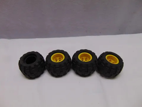 (4) Lego rubber tires with yellow rims 43.2 x 28 S 1 1/2" x 1"