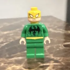LEGO Plastic Minifigure Green Outfit Yellow Head Black Torso Logo