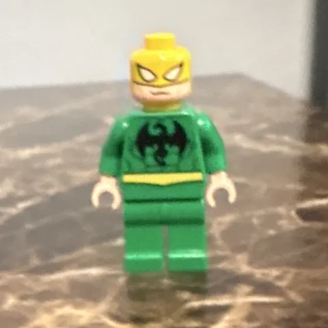 LEGO Plastic Minifigure Green Outfit Yellow Head Black Torso Logo
