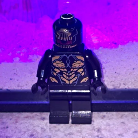 LEGO Black & Dark Gray Minifigure, Gold Chest Print, Green Translucent Accessory