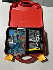 LEGO red tray filled with translucent and other unique pieces