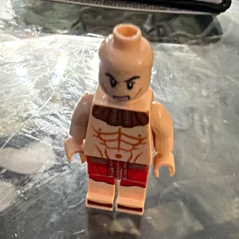 LEGO Minifigure w/ Bald Angry Face, Shirtless Tan Torso & Red Shorts, Plastic