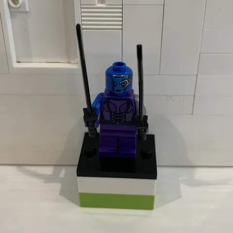 LEGO Guardians of the Galaxy MiniFigure - Nebula (76020) with two black swords.