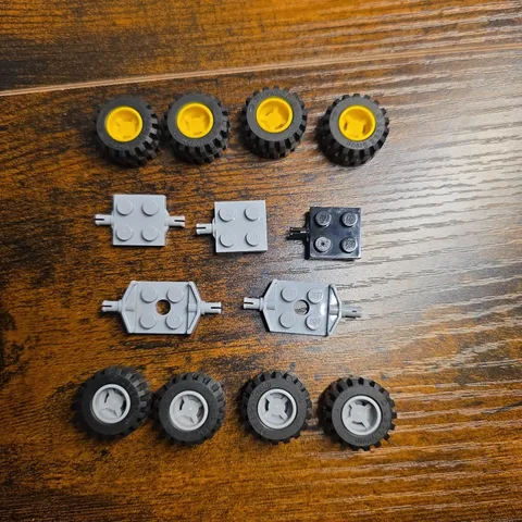LEGO Wheels and Axles Lot (20+ Pcs) – Yellow & Gray Rims, Plates, Vehicle Bases