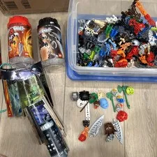 2000’s Lego Bionicle Lot Of ~9 Figures & Masks Parts Canisters Manuals Vintage