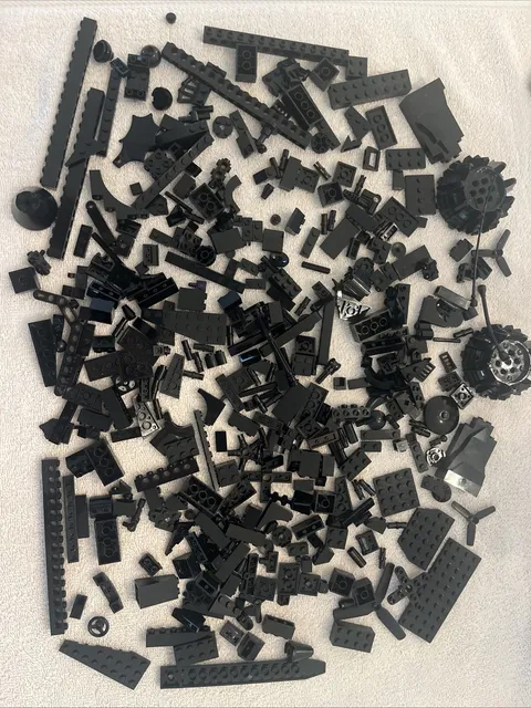 Lot of assorted  Black bricks & pieces.  13.3  ounces