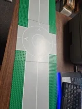 LEGO Landing Pad or Roundabout + Two Baseplate Road Sections. 