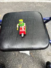 LEGO M&M Character Minifigure Green w/ Yellow Hat on Red Wheeled Base