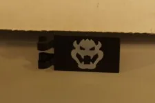 Lego New Black Tile Modified 2 x 3 w/ 2 Clips with White Bowser Head Part