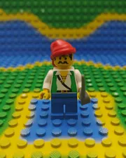 Lego pi052 minifigure Pirate with Green Vest, Blue Legs, Red Bandana