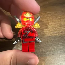 LEGO NINJAGO Red Ninja Minifigure with 2 Gray Swords, Gold Shoulder Armor