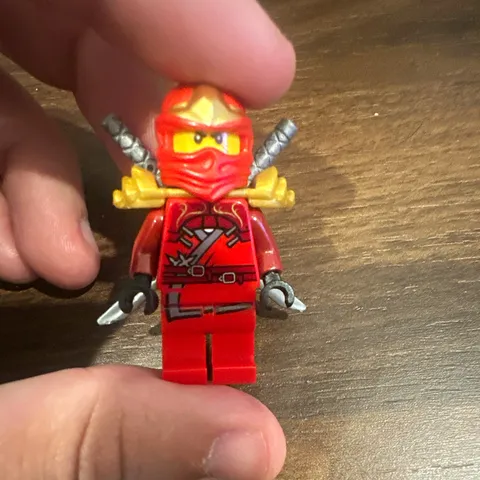 LEGO NINJAGO Red Ninja Minifigure with 2 Gray Swords, Gold Shoulder Armor