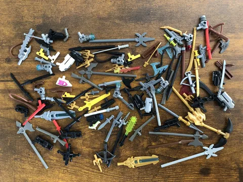 Lego Lot of Assorted Weapons. (Guns, Swords, Spears, Rifles, Axes, Shields Etc.)