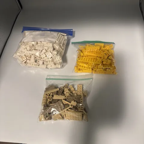 White, Yellow, And Tan Lego Pieces