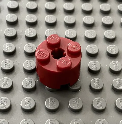 LEGO One Dark Red 2x2 Round Brick With Axle Hole