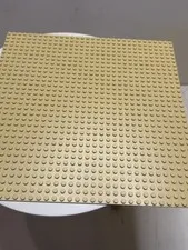LEGO baseplate. Judging by the number of studs, its size is 32 by 32 studs 
