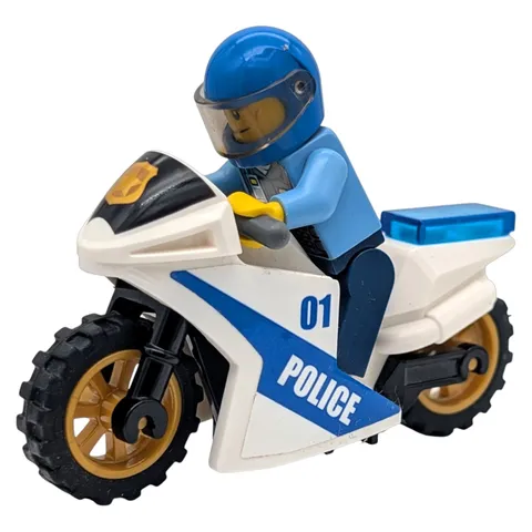 LEGO minifigure police officer with motorcycle city road