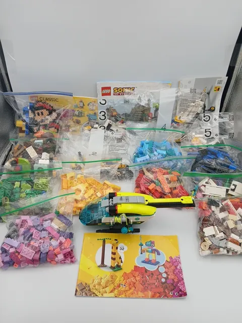LEGO Lot Of Assorted Pieces & Booklets - 13 Bags, 4 Figures,4 Books & Helicopter