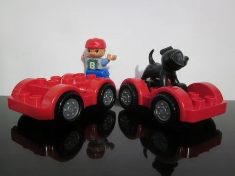 Lego 2011 Red Duplo Car Base 2 x 6 Black Tires Gray Wheels Dog Boy Figure