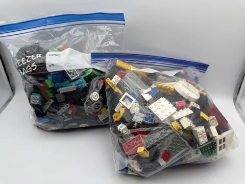 Lot Of 4.5lb Random Legos ; Wheels, Lego Pieces & Qbert Coloring Book