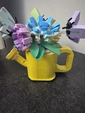 Spring Yellow Watering Can With Flowers And Butterflies