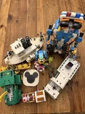 Lego set lot, robot, recycle truck, steamboat willie, parrot, tractor