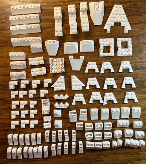 Lego lot of 110 assorted WHITE slopes, chassis bases, brackets, wedges, etc.
