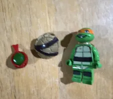 LEGO Michelangelo TMNT Minifigure w/ Turtle Shell Accessory & Extra Raphael Head