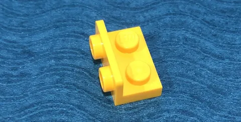 LEGO PART 99780 BRACKET PLATE W/STUDS ON INSIDE 1x2 (YELLOW)