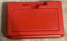 1985 LEGO red plastic storage and carrying case with assorted LEGO pieces. OFNW