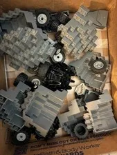 12 LEGO Mountain Wall Parts and random Lego wheels