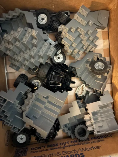 12 LEGO Mountain Wall Parts and random Lego wheels