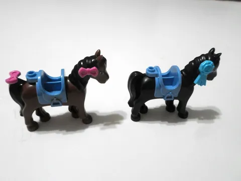 2 Lego Friends Horses with saddles.   BLACK AND BROWN