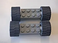Lego lot of 2 Gray Leoo Blocks And Tires