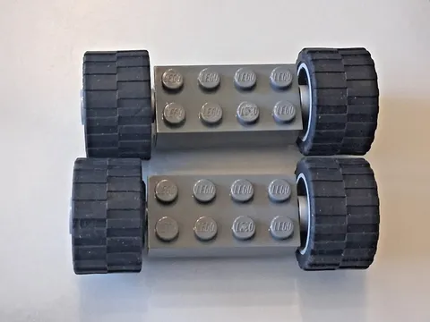 Lego lot of 2 Gray Leoo Blocks And Tires