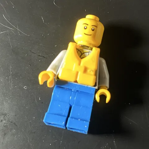 LEGO Minifigure Yellow Vest, White Torso, Gray Shirt/Arms, Blue Legs