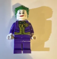 LEGO The Joker Minifigure Purple Suit Green Hair with lego gun shooting ribbon
