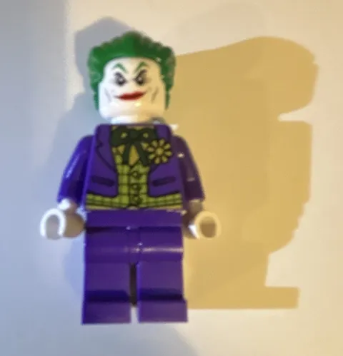 LEGO The Joker Minifigure Purple Suit Green Hair with lego gun shooting ribbon