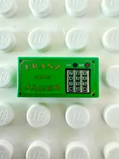 LEGO Tile 1x2 w Gold 'FRANZ JÄGER', '2003', and Silver Numeric Keypad 3069pb0031