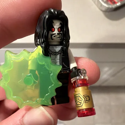 LEGO Minifigures Lobo Minifigure w/ Green Blast Effect & Bottle from set 76096