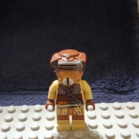 This is the LEGO Star Wars minifigure of Princess Leia in her Boushh disguise